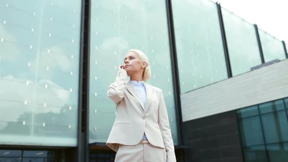 Serious Businesswoman With Smartphone Outdoors 2