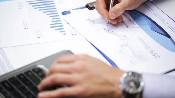 Businessman Hands With Laptop And Papers In Office 3