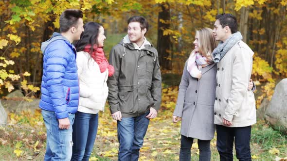 Group Of Smiling Men And Women In Autumn Park 8
