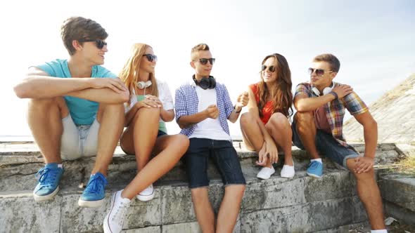 Group Of Smiling Teenagers Hanging Out Outdoors 2