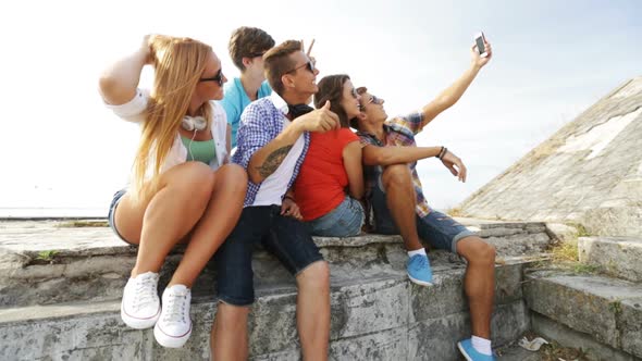 Group Of Smiling Teenagers Making Selfie Outdoors 1
