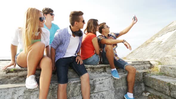 Group Of Smiling Teenagers Making Selfie Outdoors 2