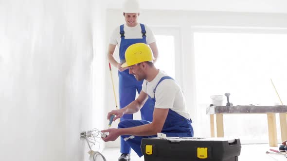 Smiling Builders With Tablet Pc And Equipment 5