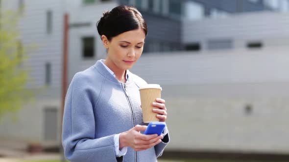 Smiling Woman With Coffee Cup And Smartphone