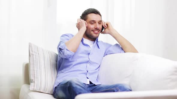 Smiling Young Man With Headphones At Home 2