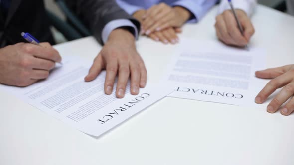 Businessmen Signing A Contract