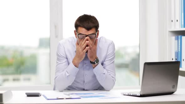 Busy Businessman With Laptop And Papers In Office 12