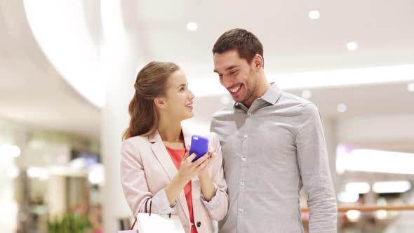 Happy Couple With Smartphone Taking Selfie In Mall 2