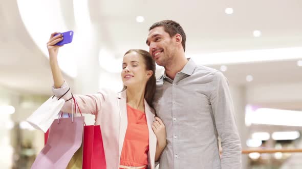 Happy Couple With Smartphone Taking Selfie In Mall 3