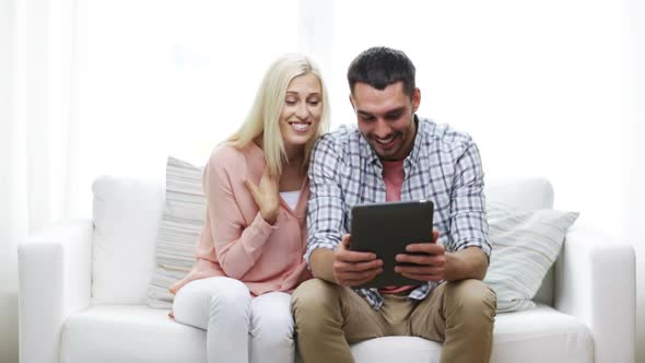 Happy Couple With Tablet Pc At Home 1
