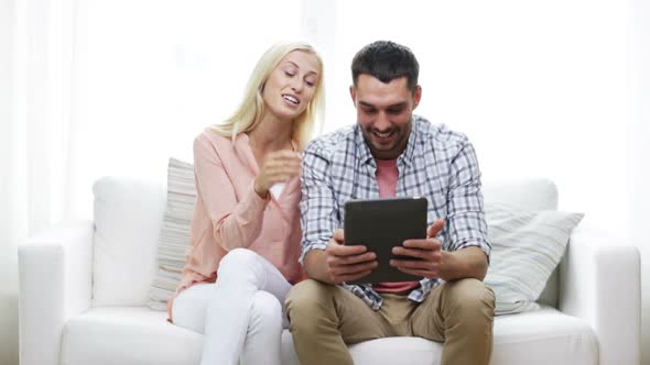 Happy Couple With Tablet Pc At Home 2