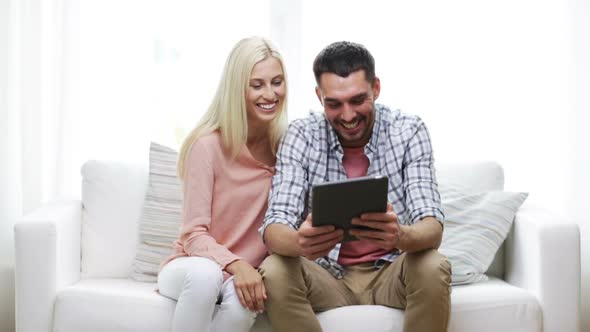 Happy Couple With Tablet Pc At Home 6