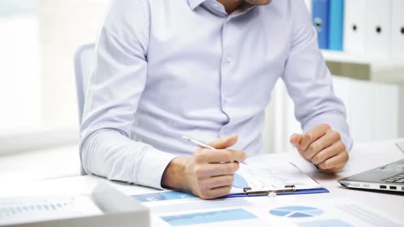 Busy Businessman With Laptop And Papers In Office 23