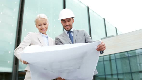 Smiling Businessmen With Blueprint And Helmets 6