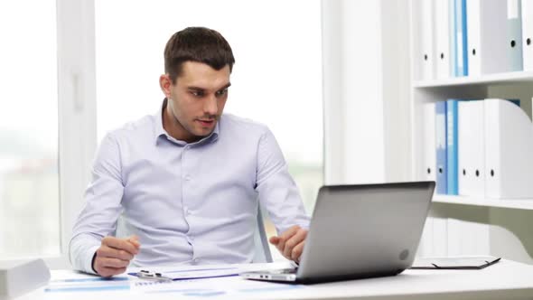 Busy Businessman With Laptop And Papers In Office 8 alt