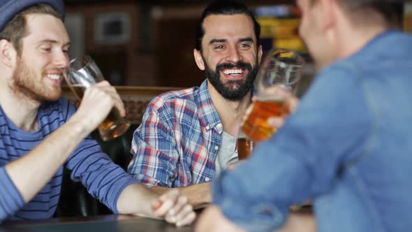 Happy Male Friends Drinking Beer At Bar Or Pub 1