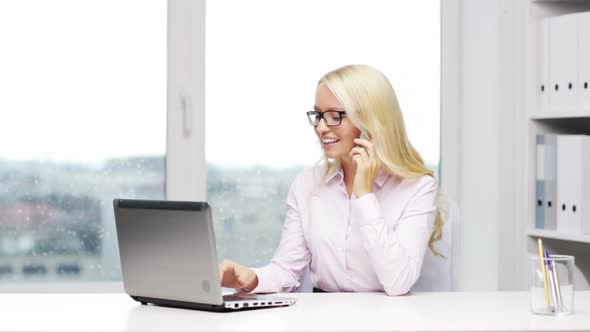 Smiling Businesswoman With Laptop And Smartphone 1