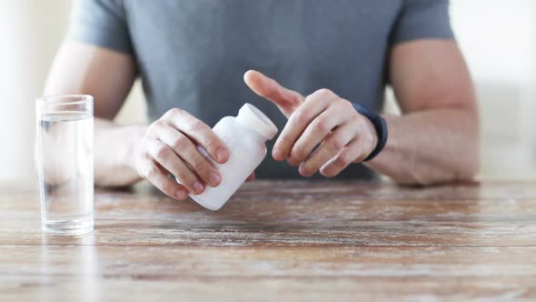 Close Up Of Man Pouring Fish Oil Capsules To Hand 1 alt