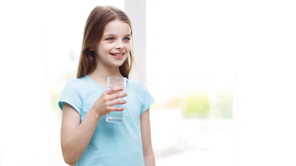 Happy Smiling Little Girl Drinking Water At Home 2