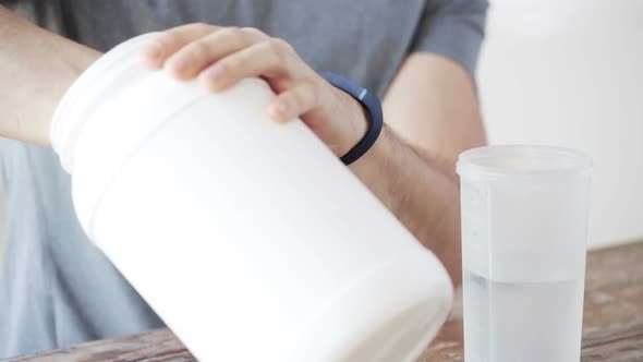 Close Up Of Man With Protein Shake Bottle And Jar 5