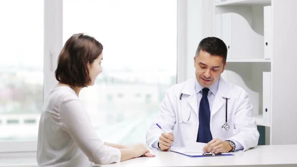 Smiling Doctor And Young Woman Meeting At Hospital 1