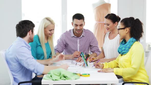 Smiling Fashion Designers Working In Office 2
