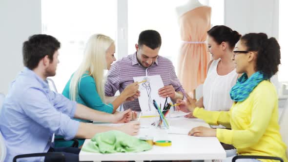 Smiling Fashion Designers Working In Office 4