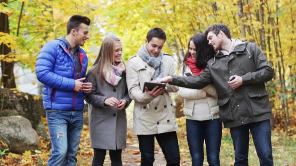 Smiling Friends With Smartphones And Tablet Pc 8