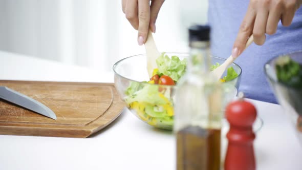 Close Up Of Woman Cooking Vegetable Salad At Home 1