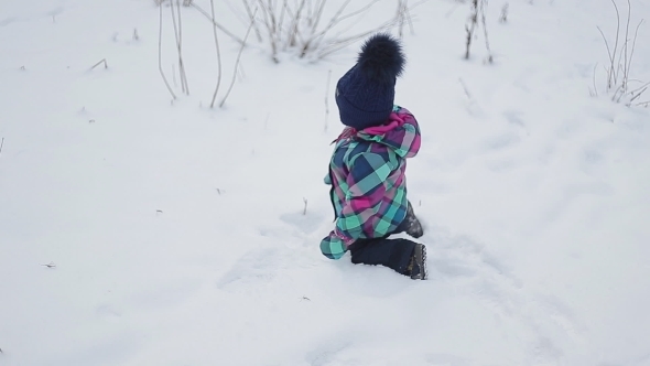 Little Girl Playing With Snow