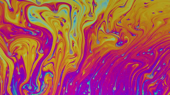 Macro soap bubble creates a colorful and psychedelic background