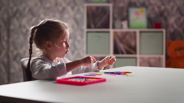 Interested Girl Learns to Count with Sticks at Mental Maths