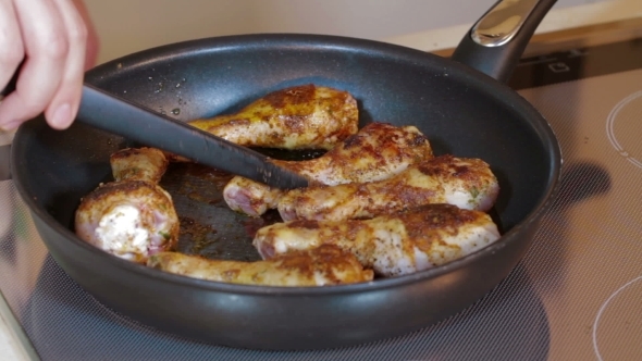 Chicken Legs Frying In a Pan