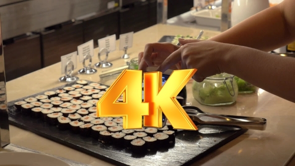 Making Photo Of Sushi With Mobile In Cafe alt