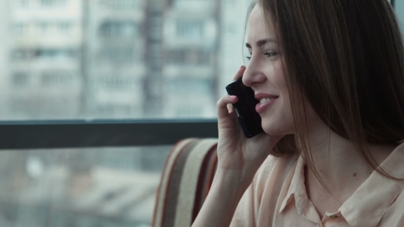 The Girl Speaks By Phone And Uses The Touchpad alt