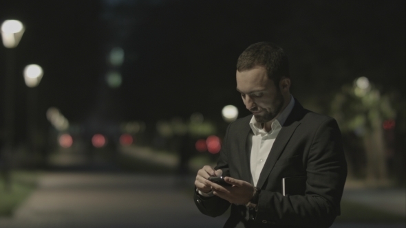 Displeased Bearded Businessman Use Smart Phone