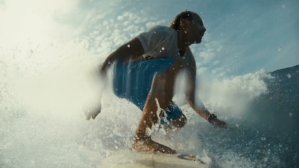 Surfer On Blue Ocean Wave In The Tube Getting