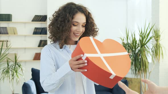 Man Presenting Gift to His Girlfriend