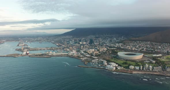 Wide Aerial Shot Tracking Forward Into the City of Cape Town During a Spectacular Sunset with Table