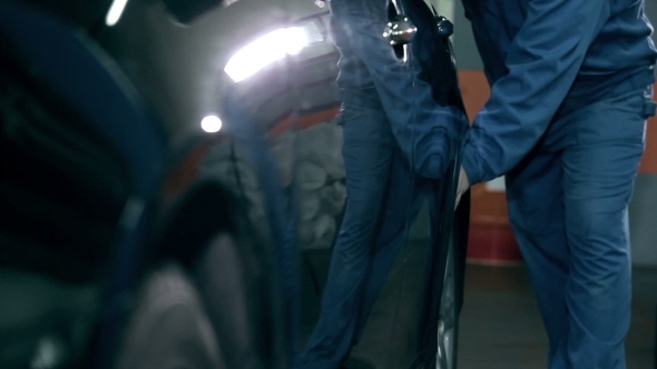 Serviceman Pushing Car To His Workplace alt