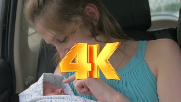 Woman Admiring With Her Child In Car