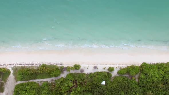 Aerial view above of beach with transparent water, Maldives island.