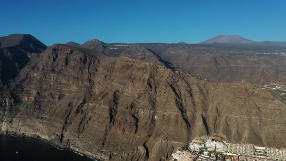 Aerial panorama of Acantilados de Los Gigantes Cliffs of the Giants at sunset, Tenerife,