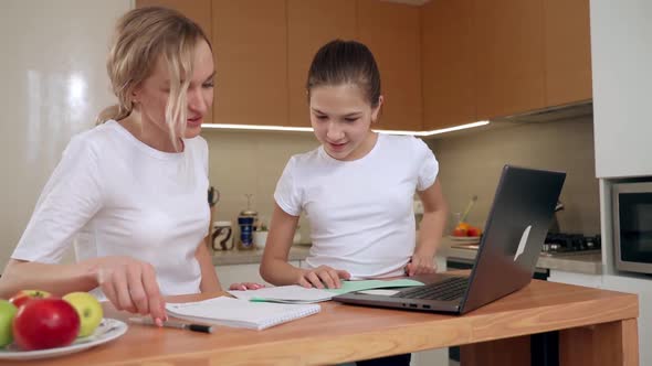 Caring Mom Babysitter Teacher Helping Kid Daughter with Homework Family Education Together