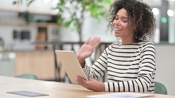 African Woman Doing Video Call on Tablet