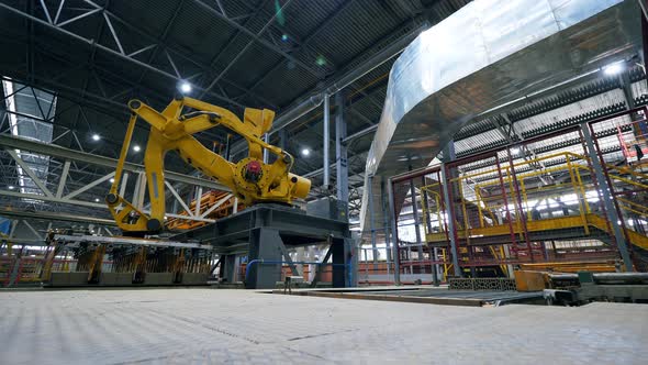 Bricks' Transferring Process Carried Out By the Factory Machine