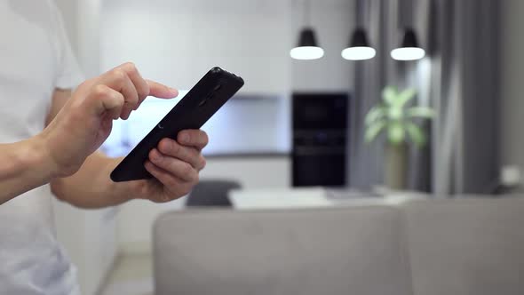 Man Hands with Smart Phone Close Up