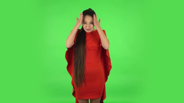 Pretty Young Woman Is Upset, Waving Her Hands in Indignation. Green Screen
