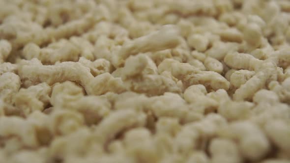 Granular dried soybean meal close-up