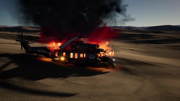 Burned Military Helicopter in the Desert at Sunset